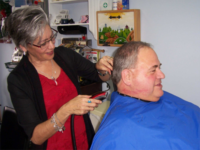 Stepping into Luc’s Barber Shop and Hairstyling is like taking a step back in time.