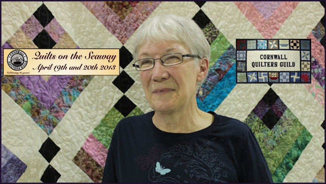 Pictured is quilt show coordinator Sharon Magee with one of her creations