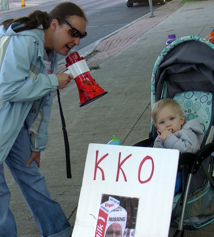 baby protester Kilger sign