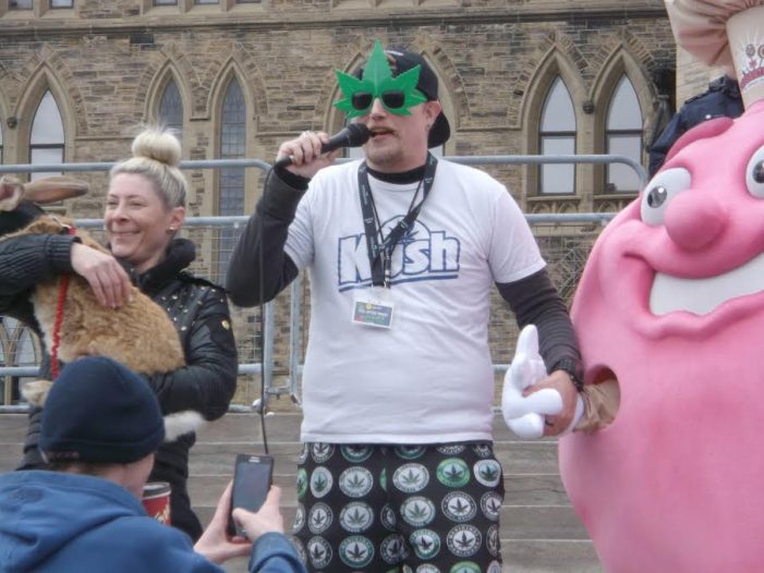 Giant Rabbit on the Steps of Parliament Hill During 4/20 by Roy Berger